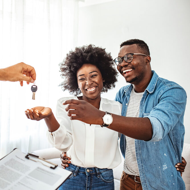 Picture of couple accepting keys 